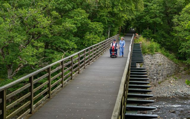 A couple walking along the Keswick to Threlkeld Railway Trail